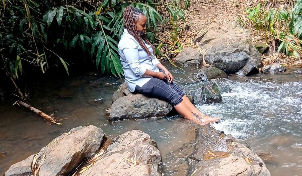 Dipping legs in water at Ololua Nature Trail